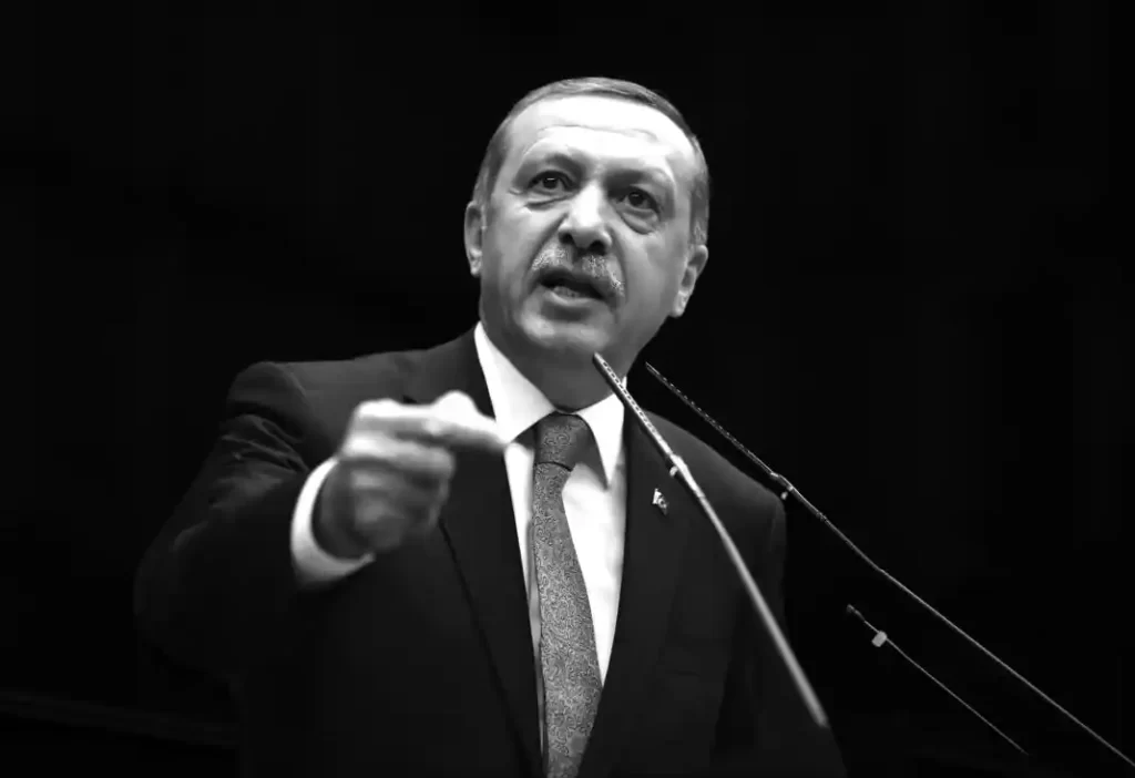 Turkey's Prime Minister Tayyip Erdogan addresses members of the parliament from his ruling AK Party (AKP) during a meeting at the Turkish parliament in Ankara February 11, 2014. REUTERS/Umit Bektas (TURKEY - Tags: POLITICS BUSINESS PROFILE)